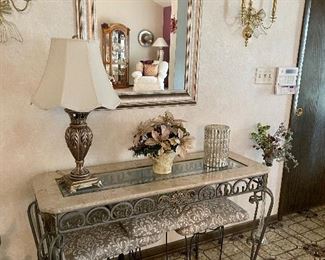 Stone and metal with glass hall table, lamps, mirror, candlestick holders, rug