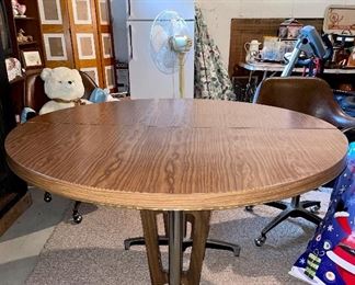 Vintage mid century modern MCM round wood and silver table, expandable with two leaves
