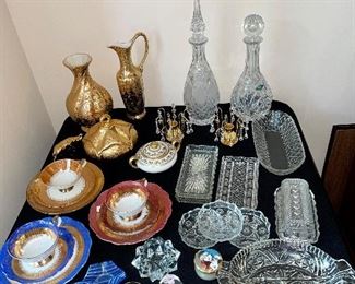 Vintage crystal trays, plates, bowls, Phantom of the opera and Les Miserables Limoges collectors boxes, Salt and pepper shakers, cups and saucers, golden crystal candle stick holders, Crystal coasters, vintage ashtrays