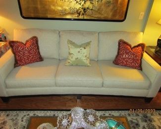 Gorgeous contemporary sofa that has been sat on maybe a dozen times.. never used as it was in a separate room that rarely was used... came from Kanes Furniture.. light green color