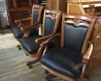 3 Leather and wood rolling office chairs 