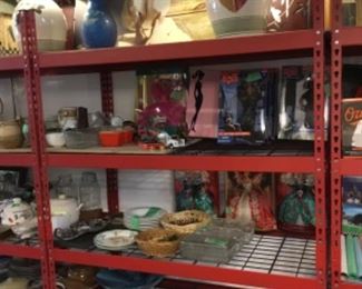 Shelves full of home goods/decor, Barbies