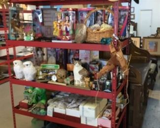 Shelves full of home goods/decor, Barbies, toys, collectibles