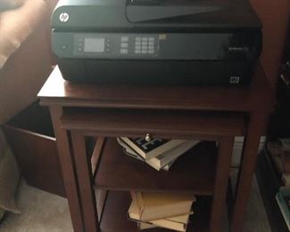 Printer shown on two nesting tables