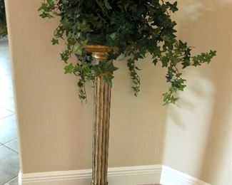 Plant stand shown with faux floral