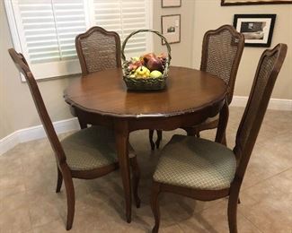 Dining table with 3 leaves and 4 chairs