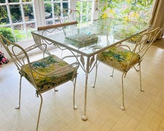 Vintage garden glass top and metal dining table with four chairs