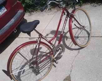 Womens 10 speed Schwinn Tourists  bicycle with newer tires, improved  seat and pouch.