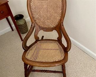 Antique chair with cane seat and back