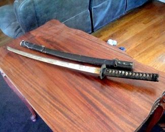World War 2 Japanese Shinto Samuri sword and leather scabbard.