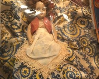 ONE OF SEVERAL VINTAGE DOLLS
