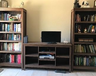 Target home furnishings: Two five shelf bookcases and matching horizontal bookcase. Tall bookcases measure 6ft tall, 2ft 6-1/2in wide, 1ft 1-3/4in deep. Horizontal bookcase measures:  41/2ft wide, 2ft 8in tall, 1ft 1-3/4in deep. Asking $200.00 for the set.
