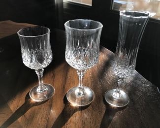 Longchamp (Clear) Lead Crystal by Cristal D’Arques-Durand:  Set of 8 Wine Glasses - $80.00; Set of 8 Water Goblets - $96.00; Set of 8 - Champagne Flutes - $80.00. (No cracks or chips!)