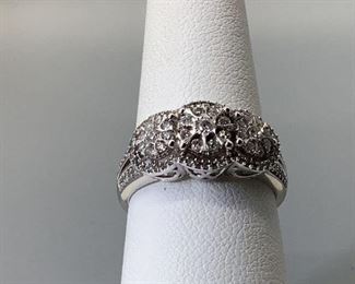 One stamped 10kt white gold custom wax and cast ring with a comfort fit shank with a rhodium plated finish. Twenty-seven shared prong set round cut diamonds and seventy-two shared prong set single cut diamonds, size 7, 3.50gtw, with appraisal report included.
