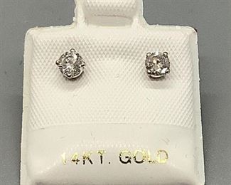 One pair of stamped 14k white gold earrings set with 2 round brilliant cut diamonds in four claws setting. 0.5gtw, includes Appraisal report.