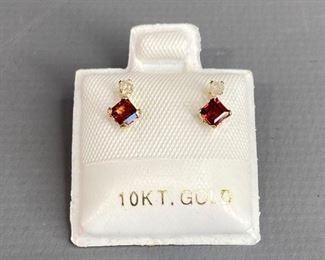 Garnet 0.4ct and diamond .06ct stud earrings, 10k.