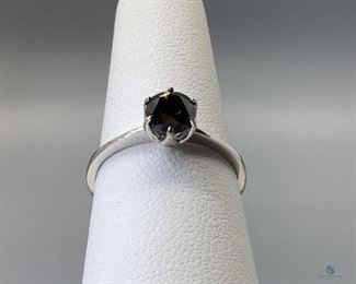 One stamped 14kt white gold cast 6-prong solitaire ring with a tapered shank with a rhodium plated finish. One prong set round brilliant cut treated diamond, 5.48x4.46mm, size 6, 1.67gtw. Appraisal certificate included.