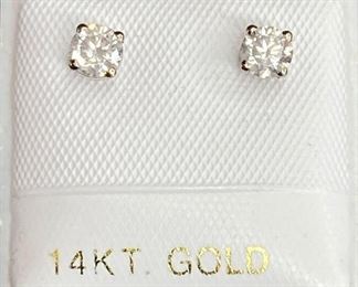 One pair of stamped 14k white gold earrings set with 2 round brilliant cut diamonds in four claws setting. 0.5gtw, 0.38ct. With Gem Services Certificate of Appraisal.