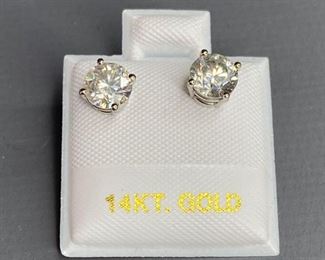 14k White gold stud earrings with rhodium plated finish. Two basket set round cut moissanite, 1.28ct. Appraisal report included.
