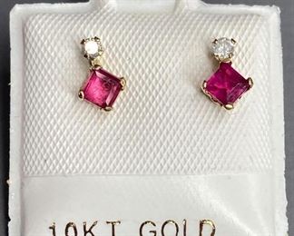 10k gold hand assembled stud earrings, two basket set square cut natural rubies, approximate 0.44ct, and two basket set round brilliant cut diamonds, approximate 0.06ct. Appraisal report included.