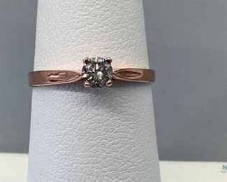 One stamped 10kt rose gold cast solitaire ring with a tapered shank with a high polish finish, size 5.5. One prong set round brilliant cut diamond, 3.70x2.22mm, 1.27gtw. Appraisal certificate included.