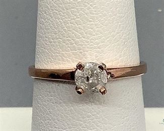 One stamped 10kt rose gold cast solitaire ring with a cathedral shank with a high polish finish. One prong set round brilliant cut diamond, 4.65x2.79mm, approximate 0.42ct., size 6.25, 1.73gtw. Appraisal certificate included.