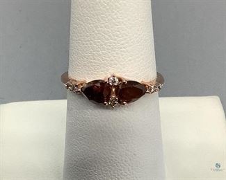 One stamped 10k Rose Gold Ring. Two prong set pear shaped cut diamonds, 5.80x4.0x2.52mm, approximate total weight of ..06ct. Appraisal report included. 1.61gtw.