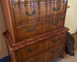 We have this high boy chest of drawers along with matching bedroom pieces, all in amazing shape! Haven't found name yet but it looks like Drexel furniture. Priced to sell! We have bedside tables and the low dresser as a set or we can seperate...