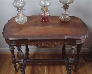Antique 6 leg wood parlor table and oil lamps