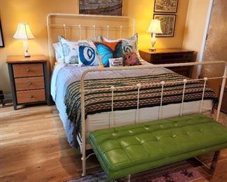 Iron bed 54" high x 60" wide; green bench 17" high x 48" wide x 19" deep