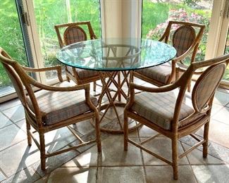 Item 91:  Vintage McGuire Glass Table & 4 Armchairs (M-26):  $1650 for set                                                                                                     Table - 42" x 28.5"                                                                                           Armchairs - 22"l x 17"w x 34.5"h