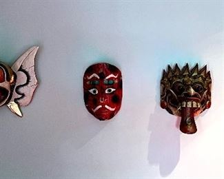 Item 232:  (4) Carved Masks:  (left-large) $48  (small) $38 each                                                                                                           Largest - 12.5" x 9"