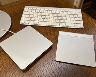 Item 273:  Apple Wireless Keyboard (Model #A1314 - rear):   $24                                                                                                         Item 274:  Apple 2012 External Drive (left):   $18                                                                                           Item 275:  Apple Trackpad (Model #A1339 - right):  $38 