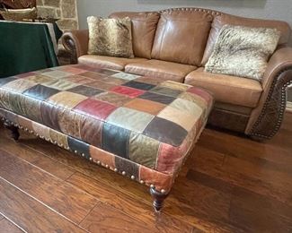 leather  nailhead and tooled sofa -  leather patchwork coffee table sized ottoman table   have matching swivel rocker-recliner to the sofa too - just beautiful 