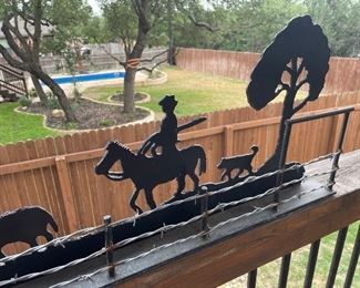 long metal sculpture- cowboy design  