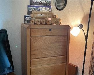 solid oak 4 dr file cabinet  mint condition- wood  toy truck - hess collectible trucks in boxes 