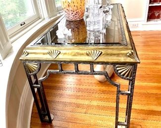 $650; ornate table of glass, brass and iron with fan details; 60”w x 29”w x 29”h