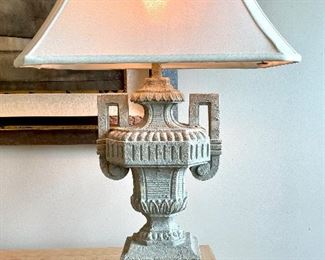 $250; Pair of urn-shaped, resin lamps (shades have cracked linings—as is) 