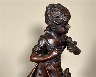 AUGUSTE MOREAU BRONZE SCULPTURE | Auguste Moreau signed bronze sculpture/statue of young girl holding a bird; h. 17-1/2 in.