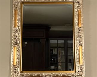 GILT WALL MIRROR | Very large gilt carved wall mirror with floral scrollwork carved accents and beveled glass; 52 x 42 in.