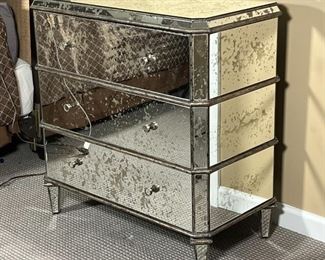 CURREY & Co. MIRRORED CHEST | Antiqued mirrored accent chest designed by Currey & Company, three drawer side table / nightstand accented with subtle horizontal lines between each drawer over tapering legs, can be used alone or as a pair (the other being sold separately); h. 31 x 17 x 32 in.