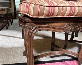 PAIR FRENCH STYLE CHAIRS | Two Rococo style side chairs with cane seats, padded upholstered seat backs and matching seat cushions in striped fabric; h. 42 x 20 x 21 in.