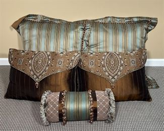 (5pc) LOT of THROW PILLOWS | Eastern Accents pillow set including: a pair of striped sham pillows (29 x 29 in.), a pair of brown throw pillows, and a lumbar throw pillow with tassels for a queen bed