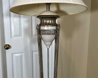 ITALIANATE FLOOR LAMP | Small urn resting on four long torch-form rods joined on a gilt scalloped base; overall h. 63 in.