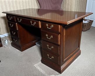 OFFICE DESK | Kneehole office desk with a middle drawer flanked by two banks of drawers (30 x 60 x 30 in.)