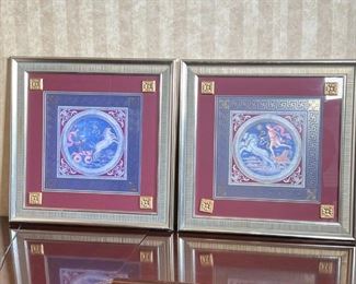 PAIR GRECO ROMAN ARTWORK | Depicting the Roman gods Mars and Apollo on chariots with gilt highlights and within gilt key borders, framed behind glass with gilt appliques on glass, with Vanguard Studios, Los Angeles label on verso; sight 14-1/4 x 14-1/4 in., overall 24-1/2 x 24-1/2 in.