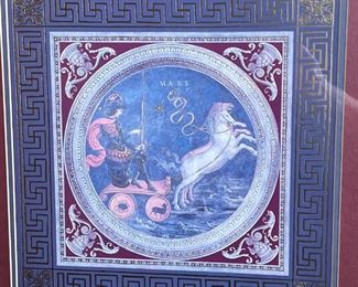 PAIR GRECO ROMAN ARTWORK | Depicting the Roman gods Mars and Apollo on chariots with gilt highlights and within gilt key borders, framed behind glass with gilt appliques on glass, with Vanguard Studios, Los Angeles label on verso; sight 14-1/4 x 14-1/4 in., overall 24-1/2 x 24-1/2 in.
