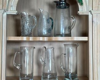 (6pc) GLASS PITCHERS | Crystal, blown glass, and glass pitchers of various sizes and forms; largest h. 12 in.