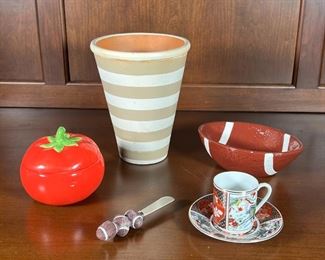 (5pc) ASSORTED FUN TABLE ITEMS | Including a floral gilt Japanese espresso cup and saucer, football shaped dip dish with matching football spreader (l. 6-1/2 in.), a lidded tomato dish, and terracotta narrow pot painted with stripes (h. 7-1/2 in.)