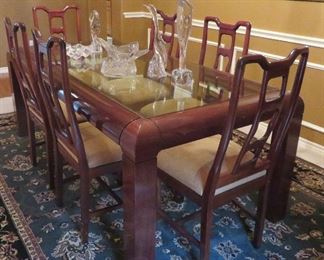 Glass top mahogany dining table.  Width - 39 1/4" x length 79" x height 29 1/2".  Also have six (6) dining chairs.  Can purchase separately or as a set.